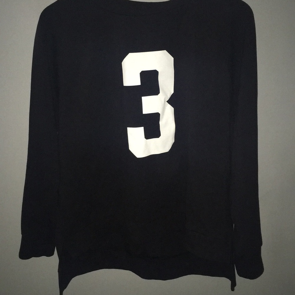 Black sweater with a number 3